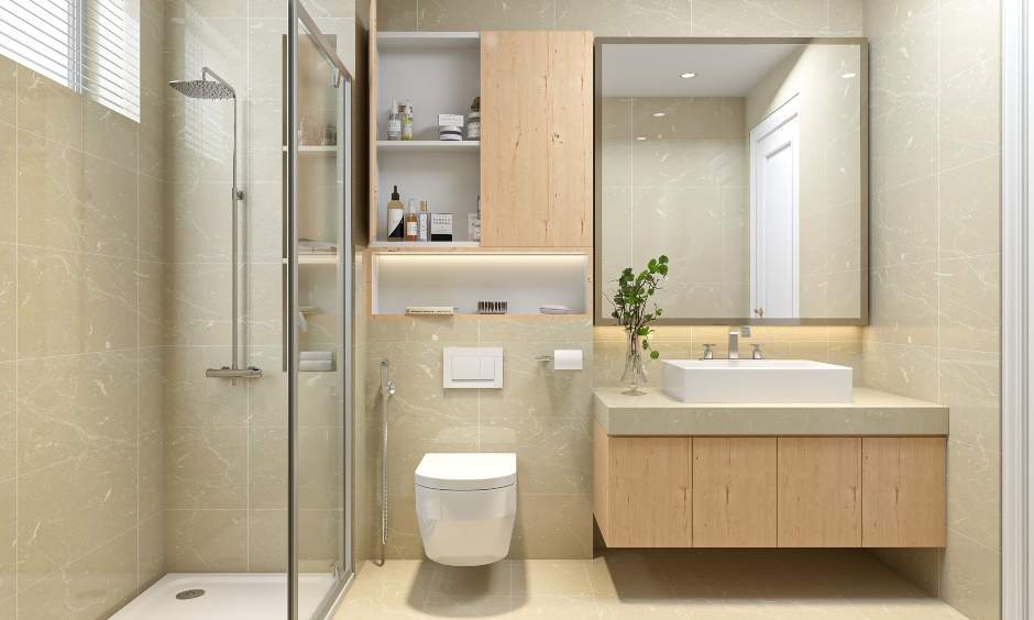 1bhk bathroom designed in a light colour palette to make the space look bigger