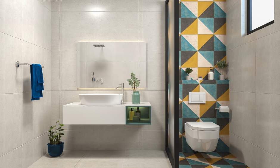 2bhk house interior design where the guest bathroom has a colourful tiled wall for a pop of colour and fun