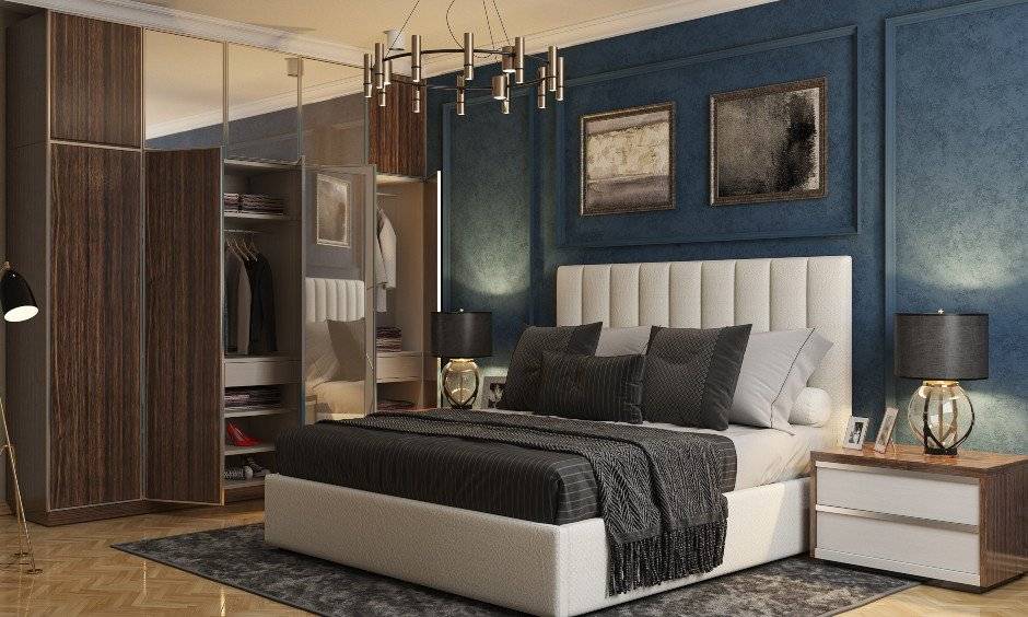 Bedroom design in Blue and white with brown wardrobe and modern bed design for Indian bedrooms