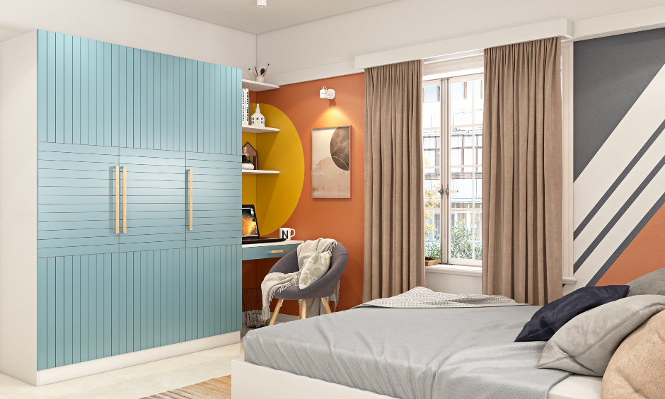 Bedroom wardrobe design where the sky-blue laminate on the door add vibrance to this bedroom's interiors