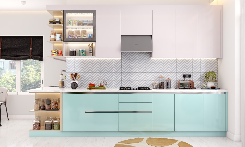 A modular kitchen with a blue base and white overhead cabinets elevates a soothing atmosphere