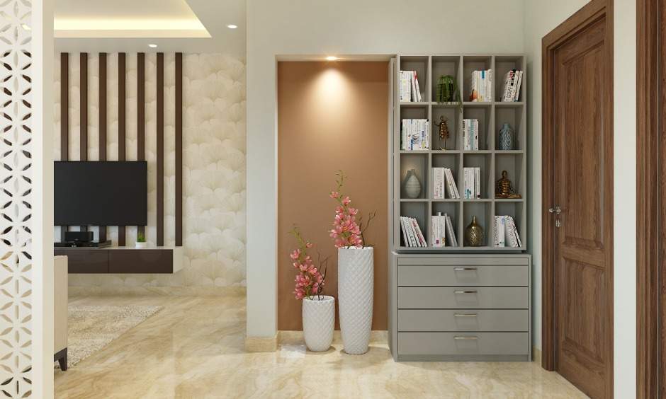 Book cabinet in 1bhk house with concealed storage and chest of drawers