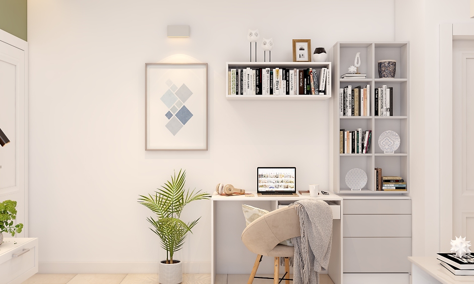 Corner study table design for the bedroom with wall-mounted shelves and a book cabinet