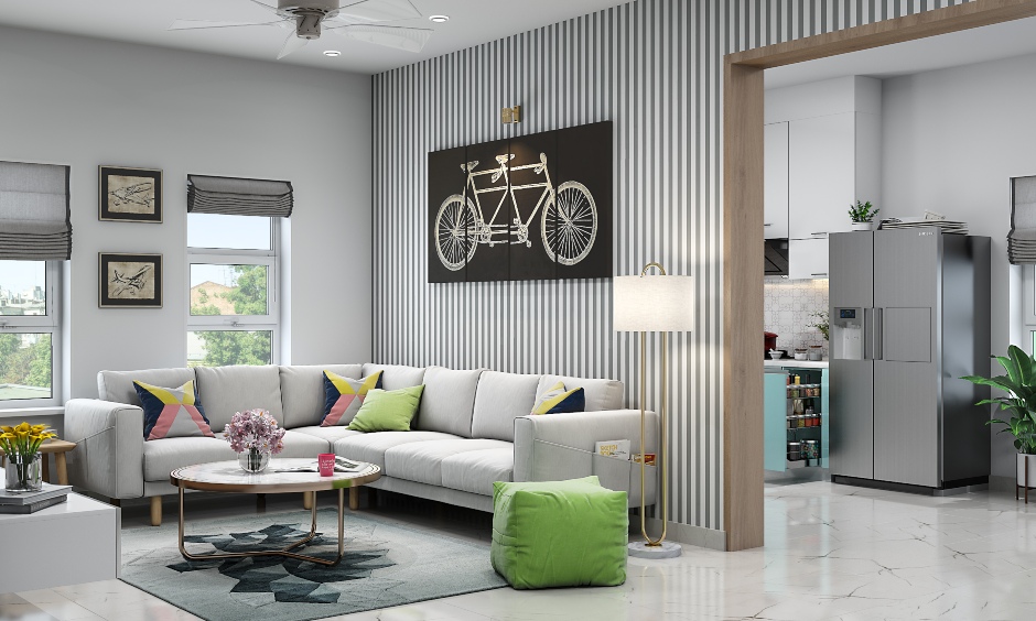 A grey living room with an L-shaped grey sofa and a marble top coffee table complemented with a floor lamp