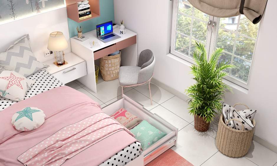 A kids bed with pull-out storage drawers underneath, accompanied by floating bedside tables