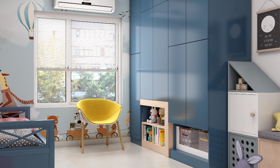 A modern and stylish kids room featuring a handless blue wardrobe.