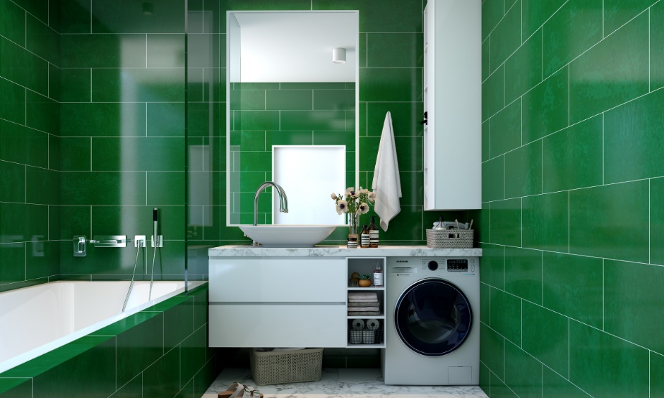 Luxury bathroom design featuring rectangular bathtub, emerald green tiled wall, and under sink storage.