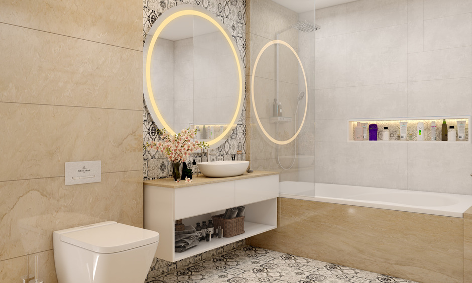 Beige and white master bathroom with floating vanity, round LED mirror, and bathtub.