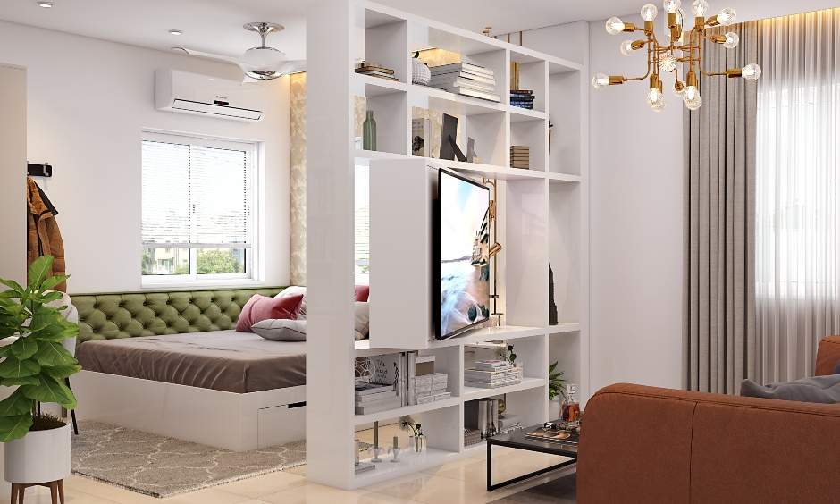 A modern living room cum bedroom with a rotating tv unit doubles as a partition