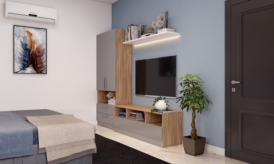 Modern minimalist bedroom design comprises an l-shaped tv unit and a small floating shelf