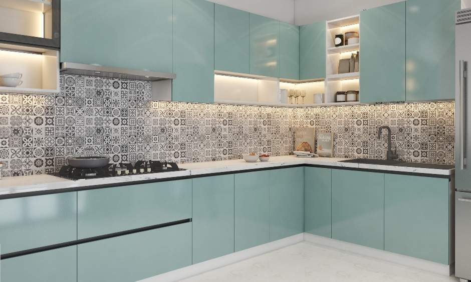 Well-lit pastel blue kitchen design with handless cabinets and sink
