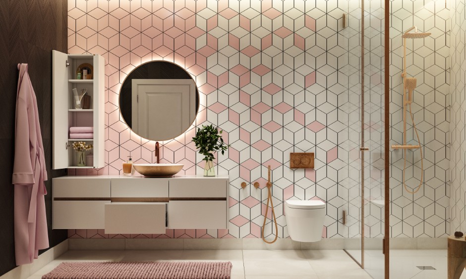 Pink and white bathroom interior with geometric tiled wall and tall storage unit for linens.