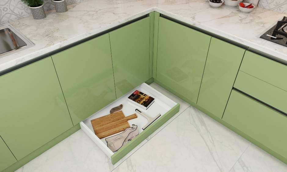 Sage green kitchen base cabinet with skirting drawers maximizes the storage space