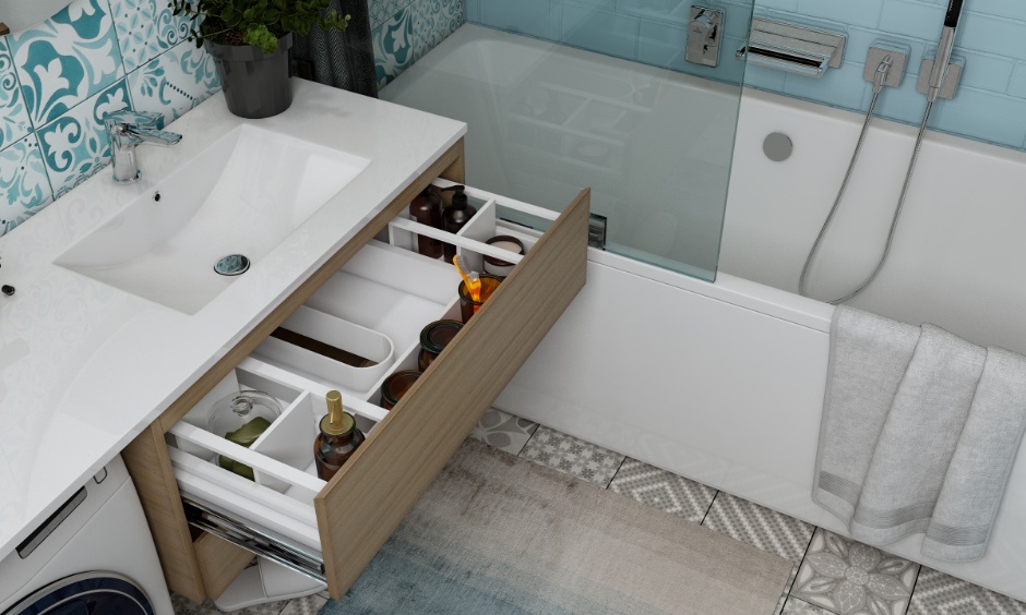 Sky blue and grey bathroom design featuring a bathtub with glass partition and patterned wall tiles.