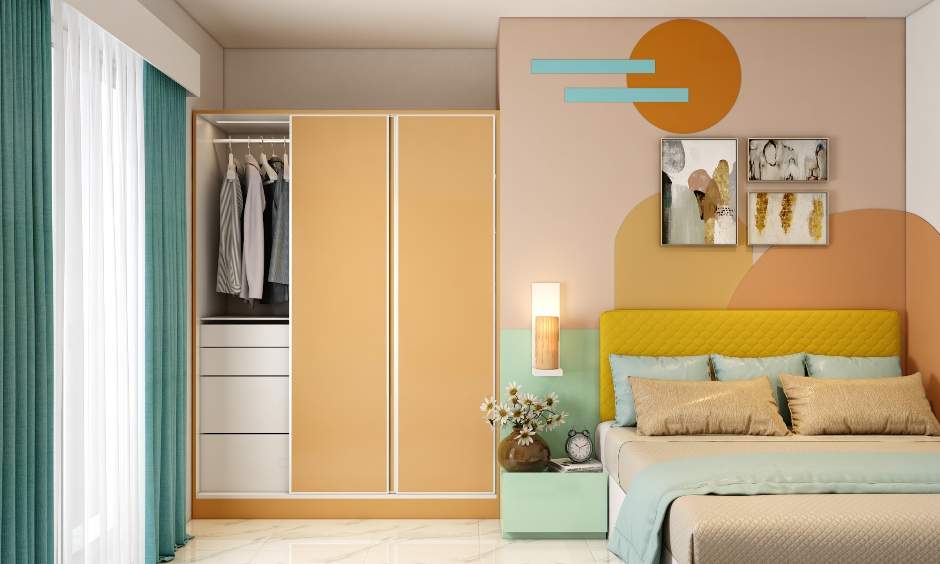 Handless three-door wardrobe design with drawers and vertical space to hang clothes for a clutter-free look