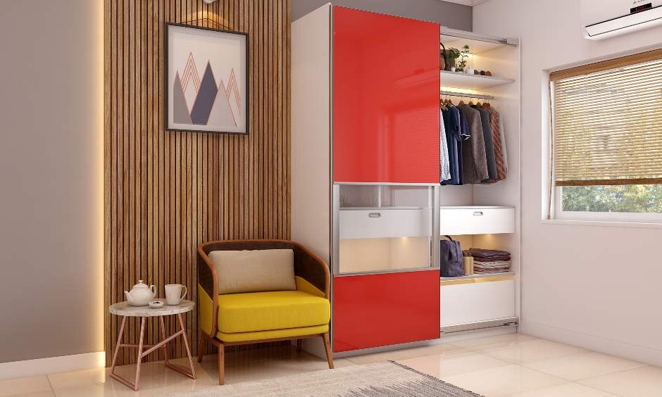 White and orange bedroom features a sliding door wardrobe