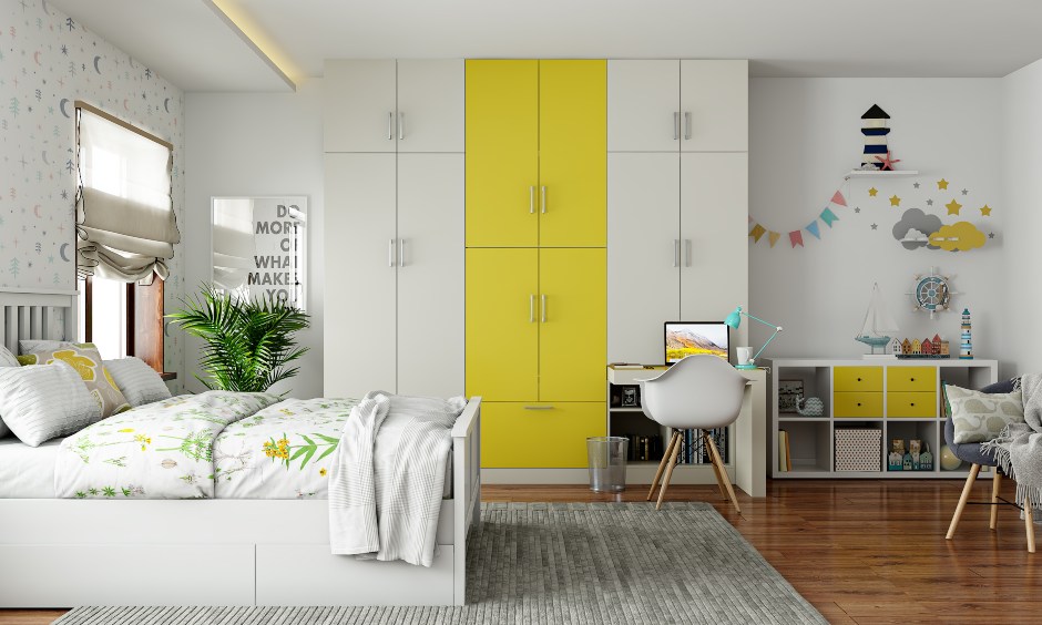 Wardrobe design in white and yellow interiors for bedroom with an an attached study table